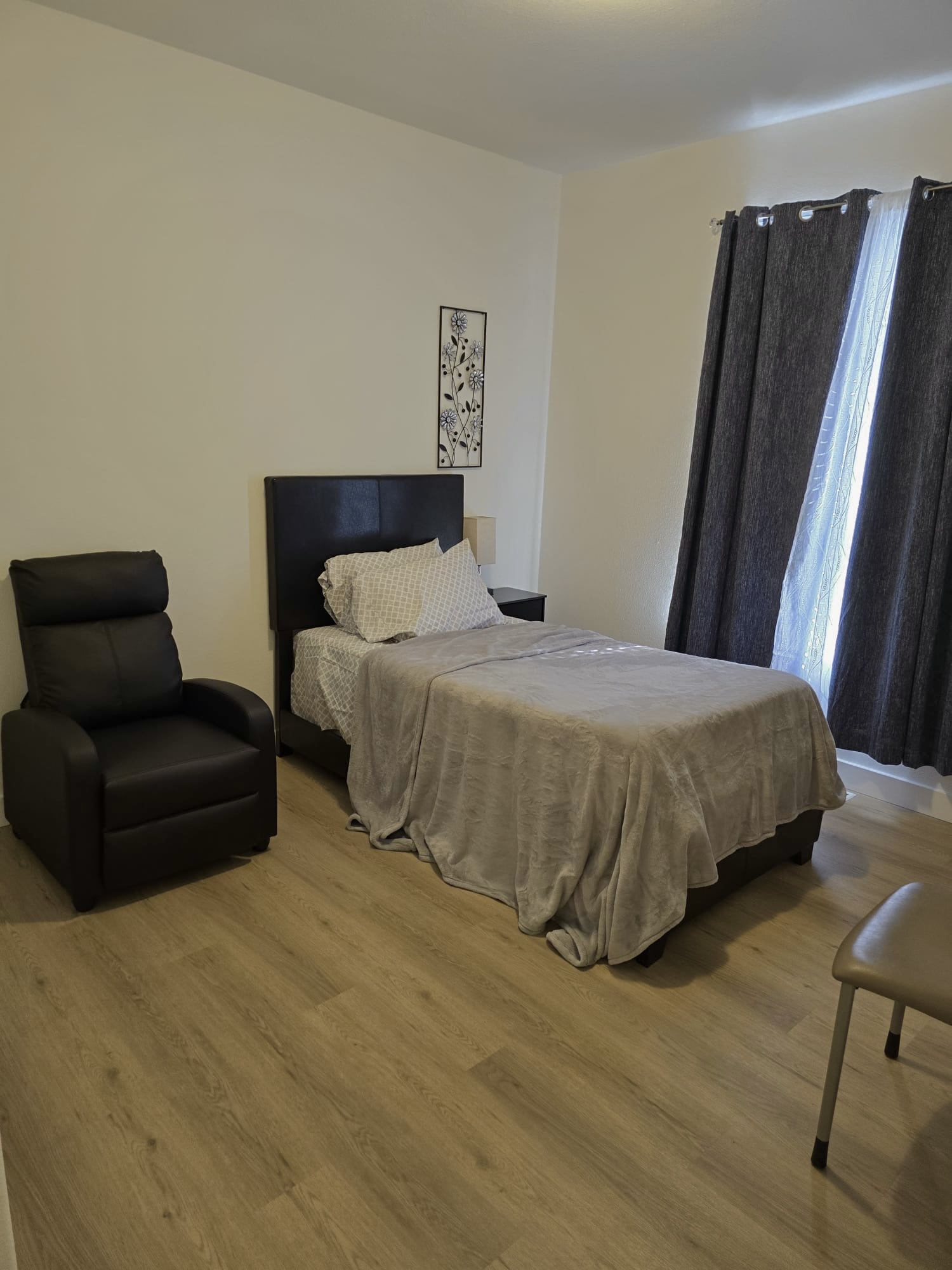 Spacious bedroom with wardrobe and TV
