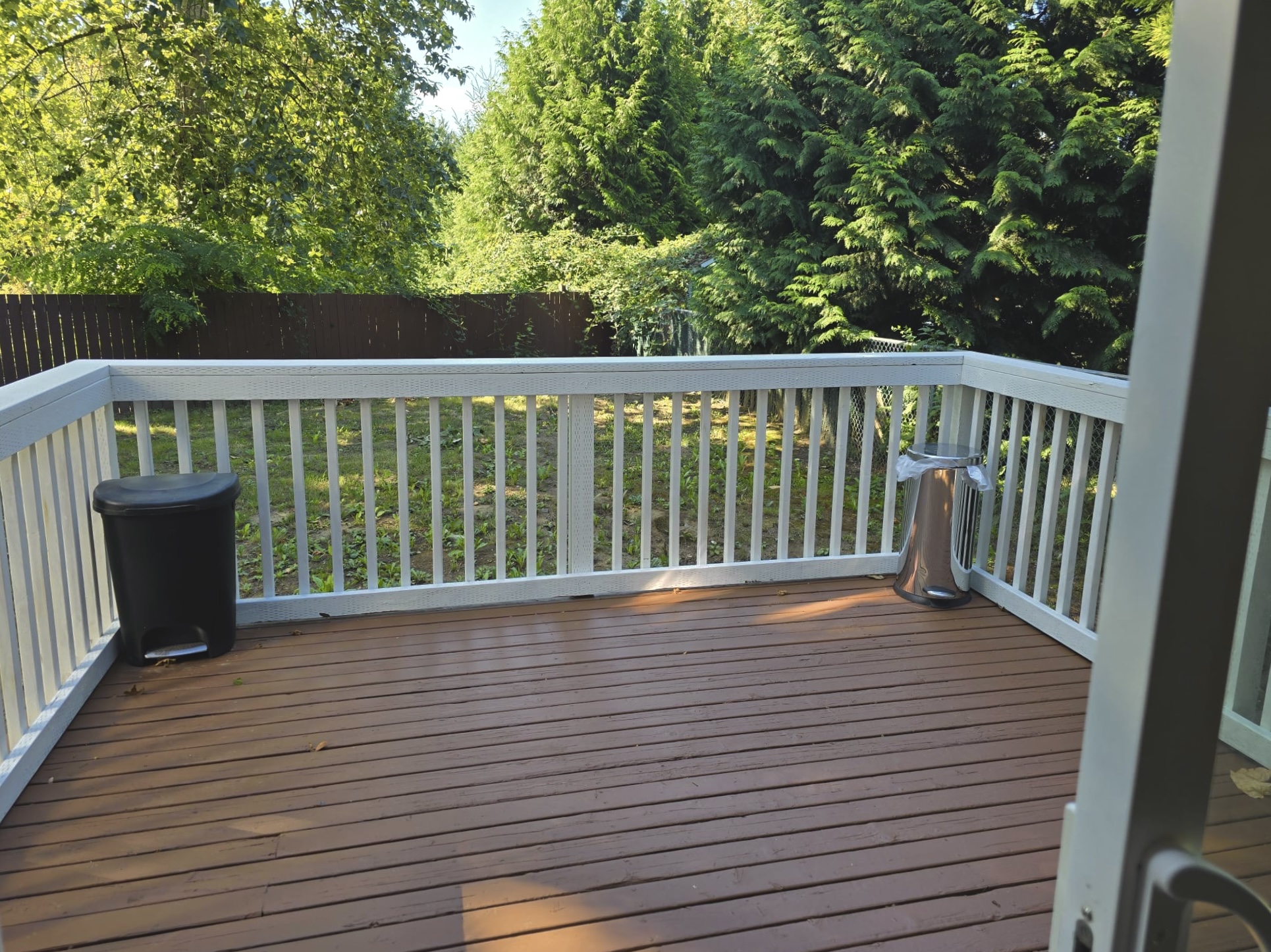 Deck with railing overlooking yard